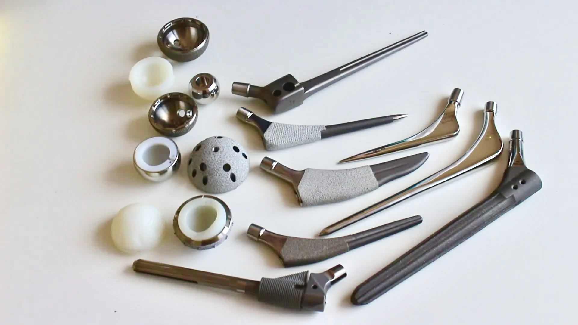 Various precision CNC-machined parts, including metallic and ceramic elements